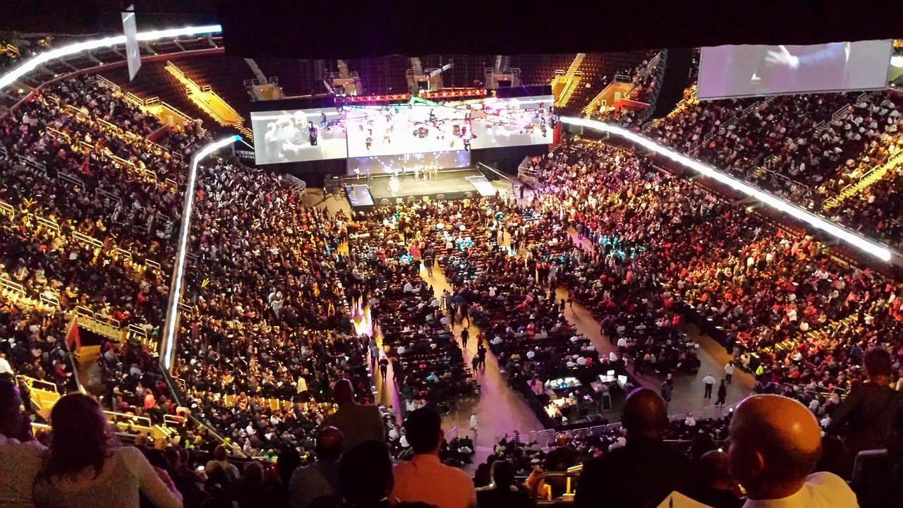 Modern corporate event with technology, screens, and networking
