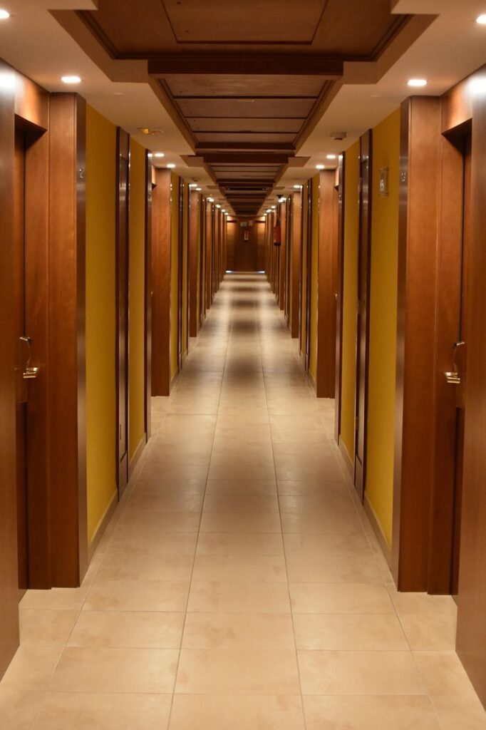 Group hotel accommodation management with coordinated room allocations